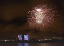 Ireland, North, Belfast, Titanic Quarter, Visitor centre designed by Civic Arts & Eric R Kuhne, illuminated during opening fireworks and projection display.