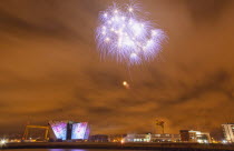 Ireland, North, Belfast, Titanic Quarter, Visitor centre designed by Civic Arts & Eric R Kuhne, illuminated during opening fireworks and projection display.