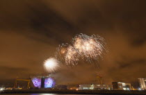 Ireland, North, Belfast, Titanic Quarter, Visitor centre designed by Civic Arts & Eric R Kuhne, illuminated during opening fireworks and projection display.