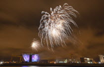 Ireland, North, Belfast, Titanic Quarter, Visitor centre designed by Civic Arts & Eric R Kuhne, illuminated during opening fireworks and projection display.