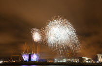 Ireland, North, Belfast, Titanic Quarter, Visitor centre designed by Civic Arts & Eric R Kuhne, illuminated during opening fireworks and projection display.