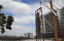 Ireland, North, Belfast, Titanic Quarter, Visitor centre designed by Civic Arts & Eric R Kuhne, with model making toy sculpture in the foreground.