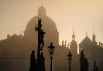 Czech Republic, Bohemia, Prague, Charles Bridge,  Calvary in early morning mist.
