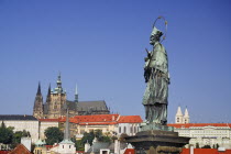 Czech Republic, Bohemia, Prague, Charles Bridge, Statue of St John of Nepomuk with St Vitus.