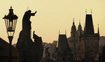 Czech Republic, Bohemia, Prague, Charles Bridge, Mala Strana Bridge Tower and dome of St Nicholas.