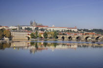 Czech Republic, Bohemia, Prague, Charles Bridge and St Vitus seen from bank of River Vltava.