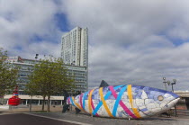 Ireland, North, Belfast, Donegall Quay The Big Fish Sculpture by John Kindness. The scales of the fish are pieces of printed blue tiles with details of Belfasts history. The 10 metre long structure is...