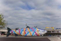 Ireland, North, Belfast, Donegall Quay The Big Fish Sculpture by John Kindness. The scales of the fish are pieces of printed blue tiles with details of Belfasts history. The 10 metre long structure is...