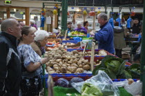 Ireland, North, Belfast, St Georges Market, Veg stall selling potatoes and cabbage.
