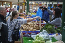 Ireland, North, Belfast, St Georges Market, Veg stall selling potatoes and cabbage.