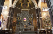 Ireland, North, Belfast, Falls Road, Clonard Monastery interior decorated for Good Friday with statues draped in purple cloth.