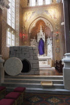 Ireland, North, Belfast, Falls Road, Clonard Monastery interior decorated for Good Friday with statues draped in purple cloth.