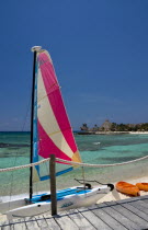 Mexico, Quintana Roo, Puerto Aventuras, View over beach and bay with colourful hobie cat.