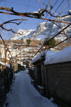 Greece, Macedonia, Zagorohoria, Little Papigko Village, Narrow and frozen alley at the well known Mikro Papigko.