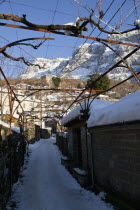 Greece, Macedonia, Zagorohoria, Little Papigko Village, Narrow and frozen alley at the well known Mikro Papigko.