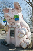 Austria, Vienna, Bank ATM housed in a pig effigy in the Wurstelprater amusement park.