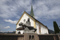 Austria, Tyrol, Brandenberg, Pieta statue outside church.