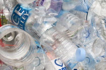 Environment, Recycling, Plastic bottles attached to a wire fence at the WOMAD festival, to highlight the need to recycle non-sustaninable materials.