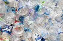 Environment, Recycling, Plastic bottles attached to a wire fence at the WOMAD festival, to highlight the need to recycle non-sustaninable materials.