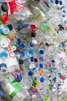 Environment, Recycling, Plastic bottles attached to a wire fence at the WOMAD festival, to highlight the need to recycle non-sustaninable materials.