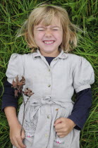 Kids, Outdoor, 5 year old Eva lying in the grass.