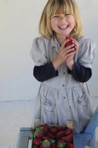 Kids, Eating, Fruit, 5 year old Eva eating first strawberries of the year in February.