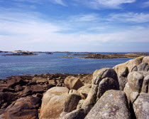 France, Brittany, Cotes d'Amor, Cote de Granit Rose,  boulders and rocky islets on sea coast near the town of trebeurden.