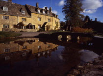 Egland, Gloucestershire, Cotswolds, Lower Slaughter. village houses reflected in the River Eye.