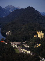Germany, Bayern, Schwangau, view looking down on town overlooked by Schloss Hohenschwangau and Alpsee.