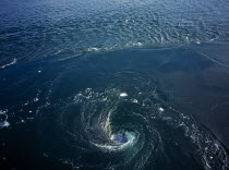 France, Bretagne, Barrage de la Rance, tidal power station. whirlpool caused by tidal water flowing down through electricity generators beneath the dam.