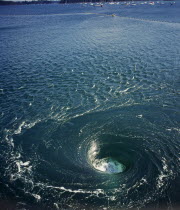 France, Bretagne, Barrage de la Rance, tidal power station. whirlpool caused by tidal water flowing down through electricity generators beneath the dam.