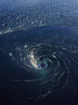 France, Bretagne, Barrage de la Rance, tidal power station. whirlpool caused by tidal water flowing down through electricity generators beneath the dam.