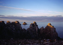 France, Bretagne, Crozon Peninsula, Pointe de Penhir. seacliffs and offshore rocks.