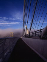 France, Bretagne, Finistere, ile de crozon. view of the old and new pont de terenez suspension bridges over the river aulne from the east side of the new footway in early morning fog.