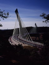 France, Bretagne, Finistere, Ile de Crozon. new pont de terenez suspension bridge view south from hillside above river aulne shows two lane carriageway and suspension supports.