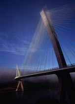 France, Bretagne, Finistere, Ile de Crozon. view of the new pont de terenez suspension bridge opened april 2011 from north bank of the river aulne in early morning fog.