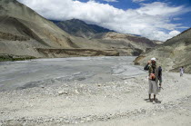 Nepa, Upper Mustang, Kali Gandaki gorge, man returning from worship.