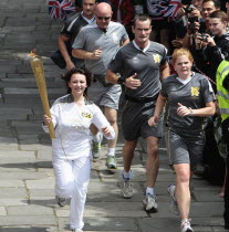 England, Kent, Tunbridge Wells, Olympic Torch relay running through the Pantiles.
