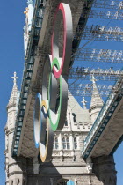 England, London, The Olympic rings suspended from the gantry of London's Tower Bridge celebrate the  2012 games. Tower bridge is a combined bascule and suspension bridge and was completed in 1894.