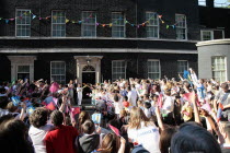 England, London, Olympic Torch relay in Downing Street, Samantha and Prime Minister David Cameron welcome the torch.