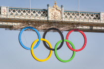 England, London, The Olympic rings, celebrating the 2012 Olympic Games, suspended from Tower Bridge.