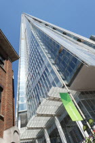 England, London, London Bridge Quarter, Looking up at the Shard designed by Renzo Piano, opened in 2012 and is the tallest building in the European Union.