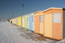 England, East Sussex, Seaford, Beach Huts in the snow.