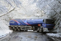 Weather, Winter, Snow, Jack-knifed fuel tanker on icy A22 main road near Nutley, East Sussex after heavy snowfall. Truck has spun and is facing in the opposite direction to the one it was travelling i...