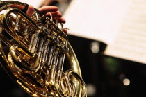 Music, Instruments, Brass, Detail of hand playing notes on a French Horn.