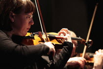 Music, Instruments, Strings, Violin, Detail of woman playing in orchestra.