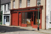 Ireland, County Tyrone, Omagh, Ulster American Folk Park, 19th century street, Blair stationer's shopfront.