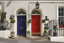 Ireland, County Cork, Kinsale, colourful doorways of terraced houses.