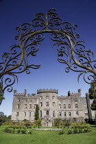 Ireland, County Sligo, Markree Castle hotel, castle and garden viewed through ornamental iron grille.