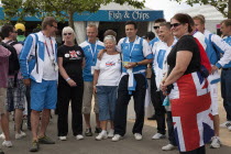 England, Lodnon, Stratford Olympic Park, Group of Team GB supporters having their photographs taken with competitors from Finland.
